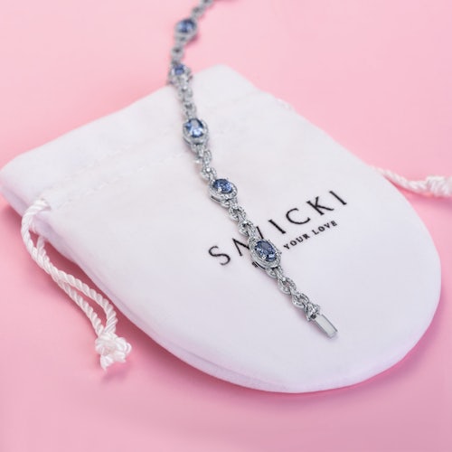 Bransoletka tenisowa SAVICKI: białe złoto, diamenty, tanzanity